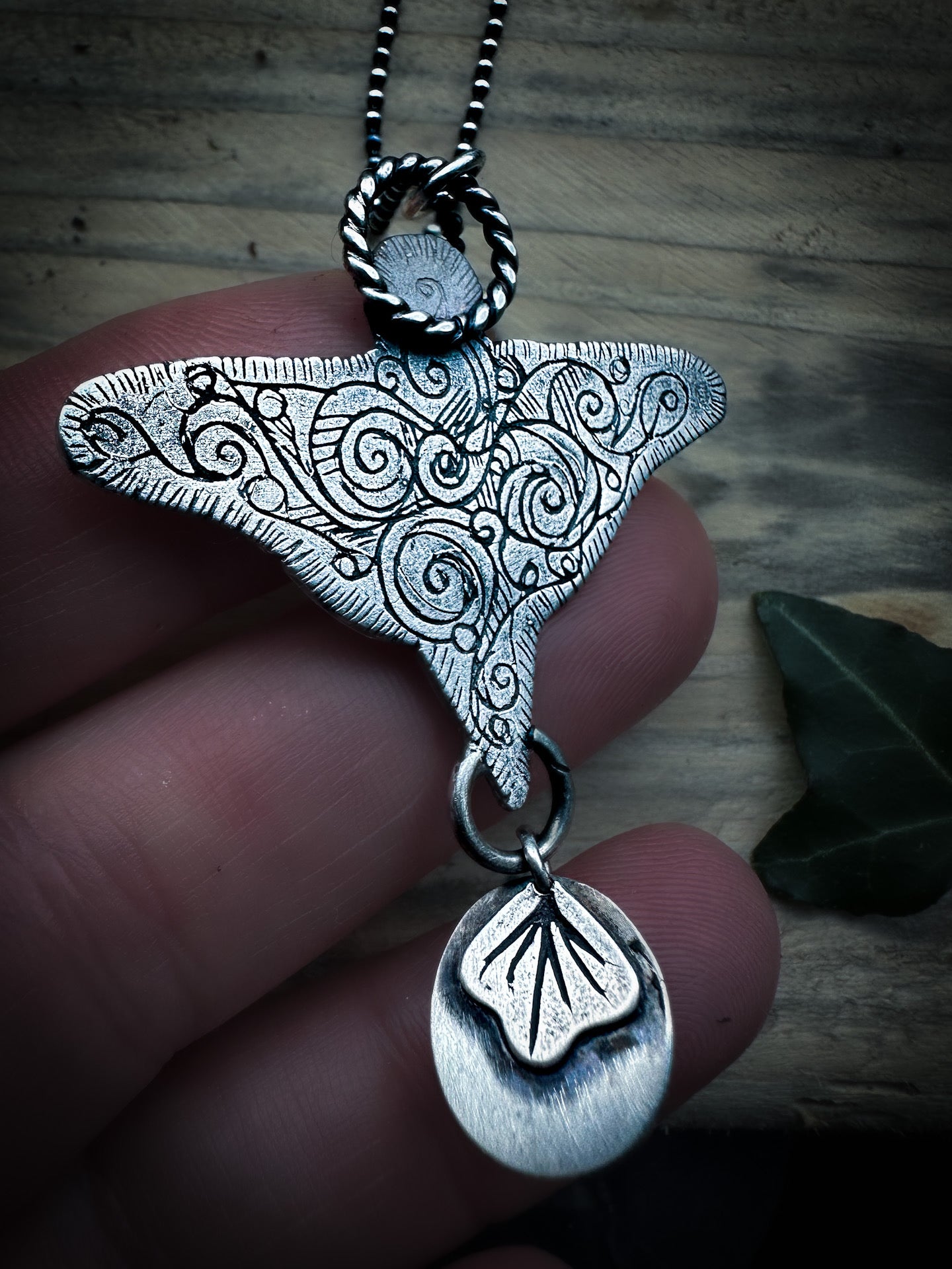 View of spiral detailing on the back of far necklace. Inspired by elemental magick. By Silver Labyrinth Jewelry