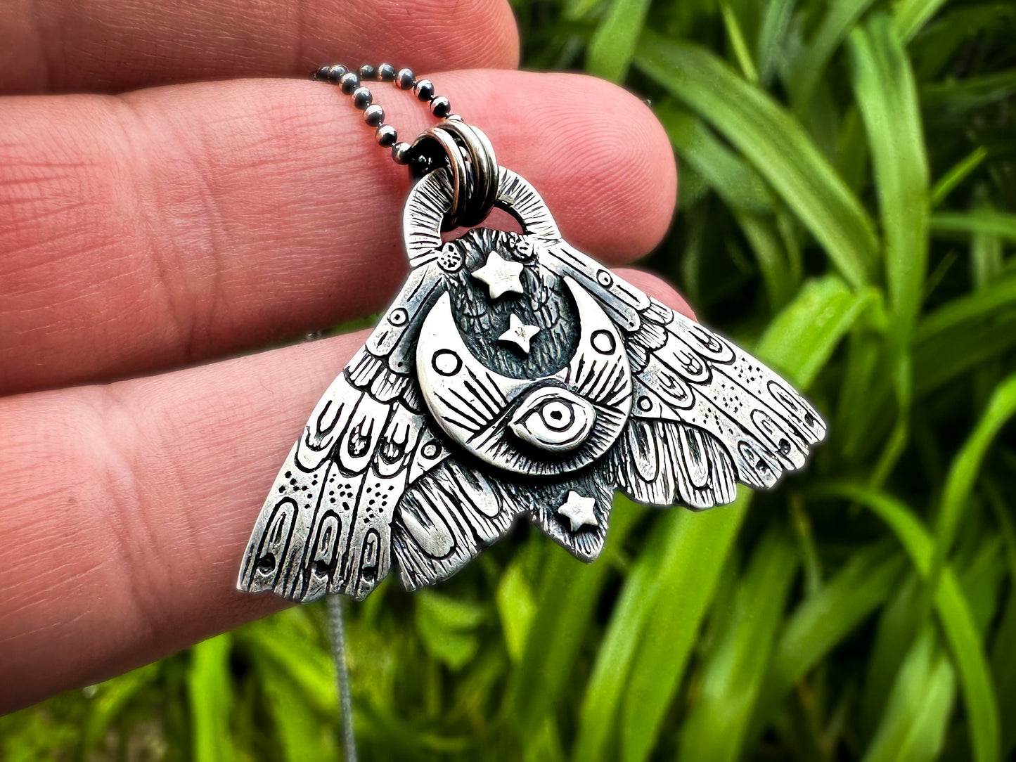 Sterling silver Moth pendant with All-Seeing Eye, representing altered consciousness and spiritual exploration. By Silver Labyrinth Jewelry