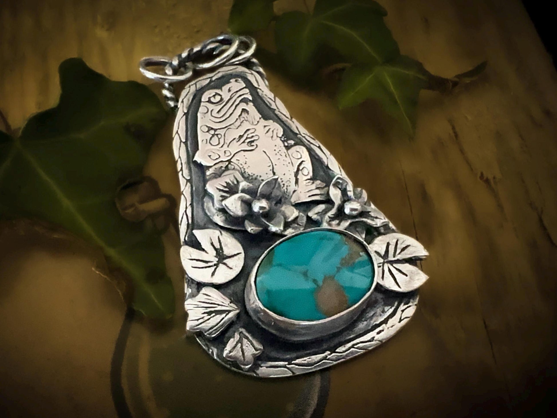 Close up of the Carco Lake Turquoise on this bewitching silver Toad pendant. By silverlabyrinthjewelry.com