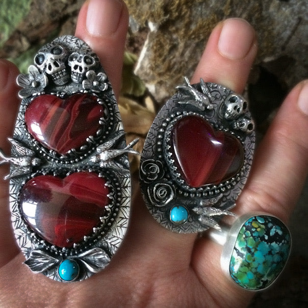 Highly detailed statement ring, handmade in sterling silver with rosarita heart, skulls, birds, flowers and a turquoise cabochon. By Silver Labyrinth Jewelry.