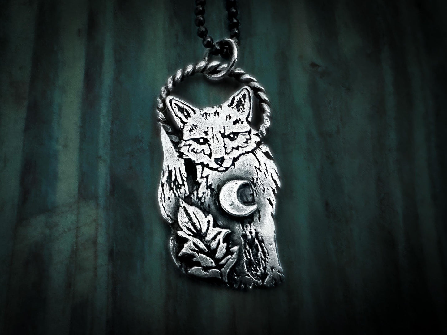 Unique fox totem pendant, featuring a crescent moon and leaf in a versatile design. By Silver Labyrinth Jewelry 