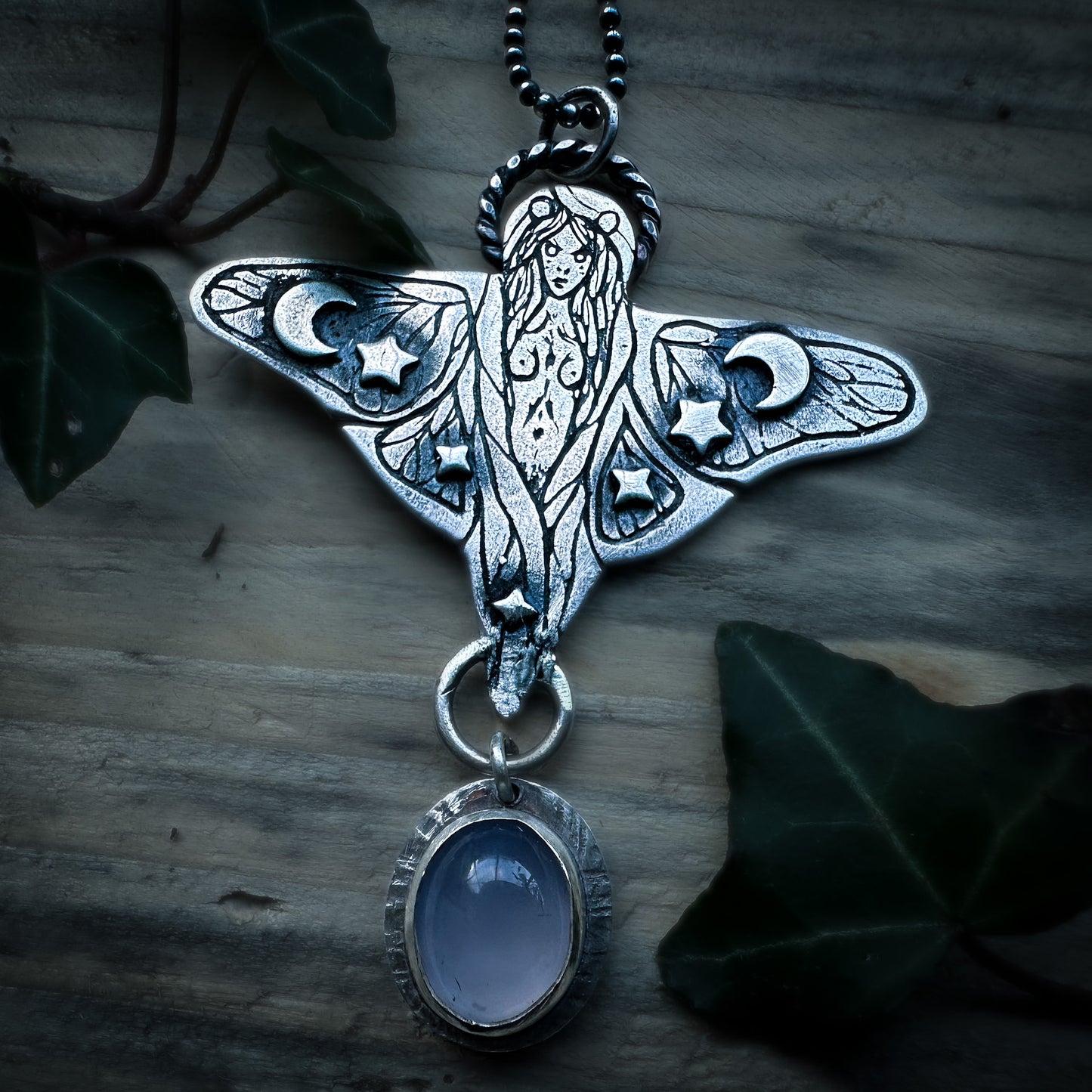 Handmade sterling silver faerie pendant with moth wings and lilac chalcedony