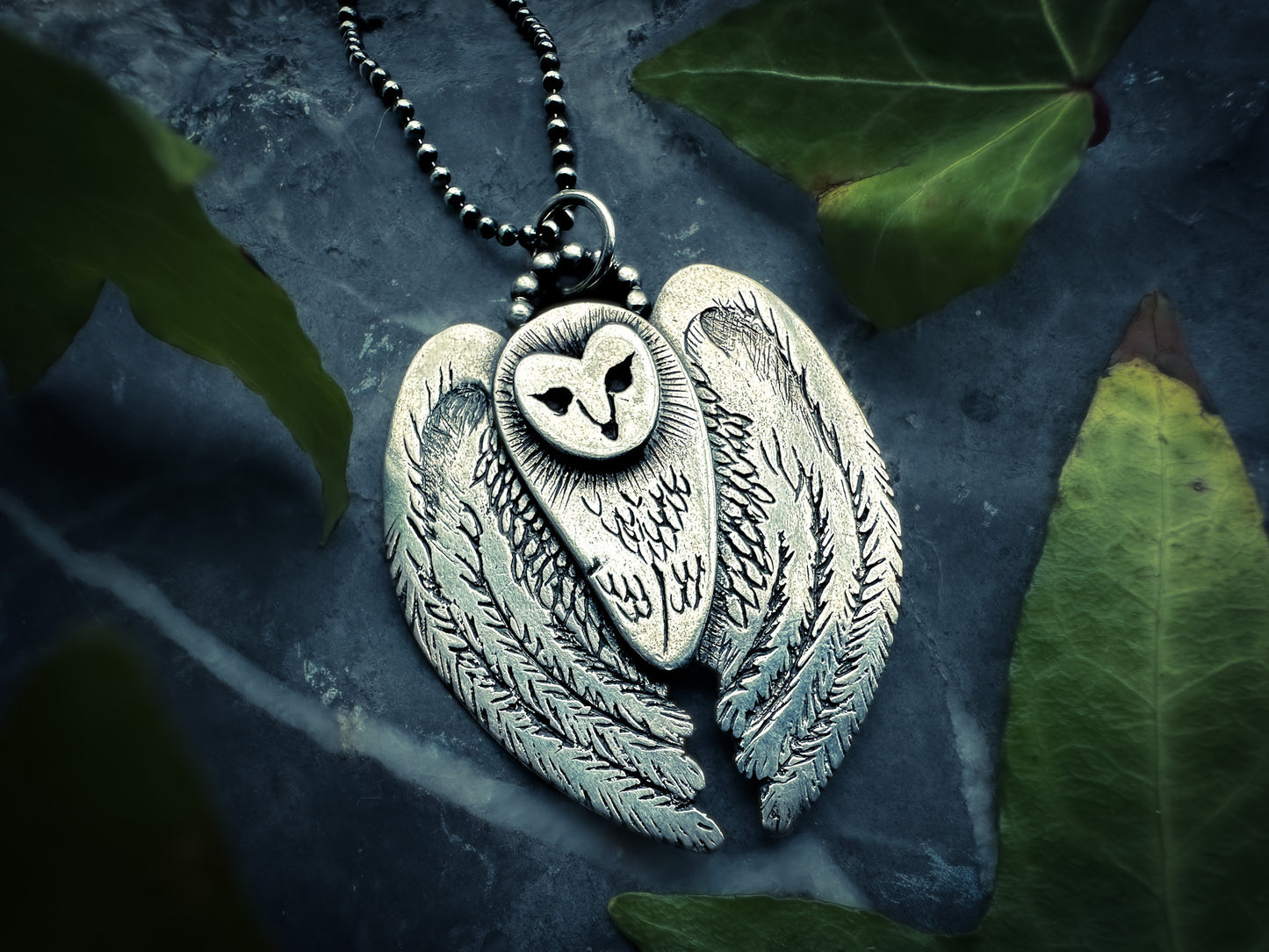 Unique animal totem jewelry featuring a flying owl design. Inspired by shamanic practice, polished with a patina