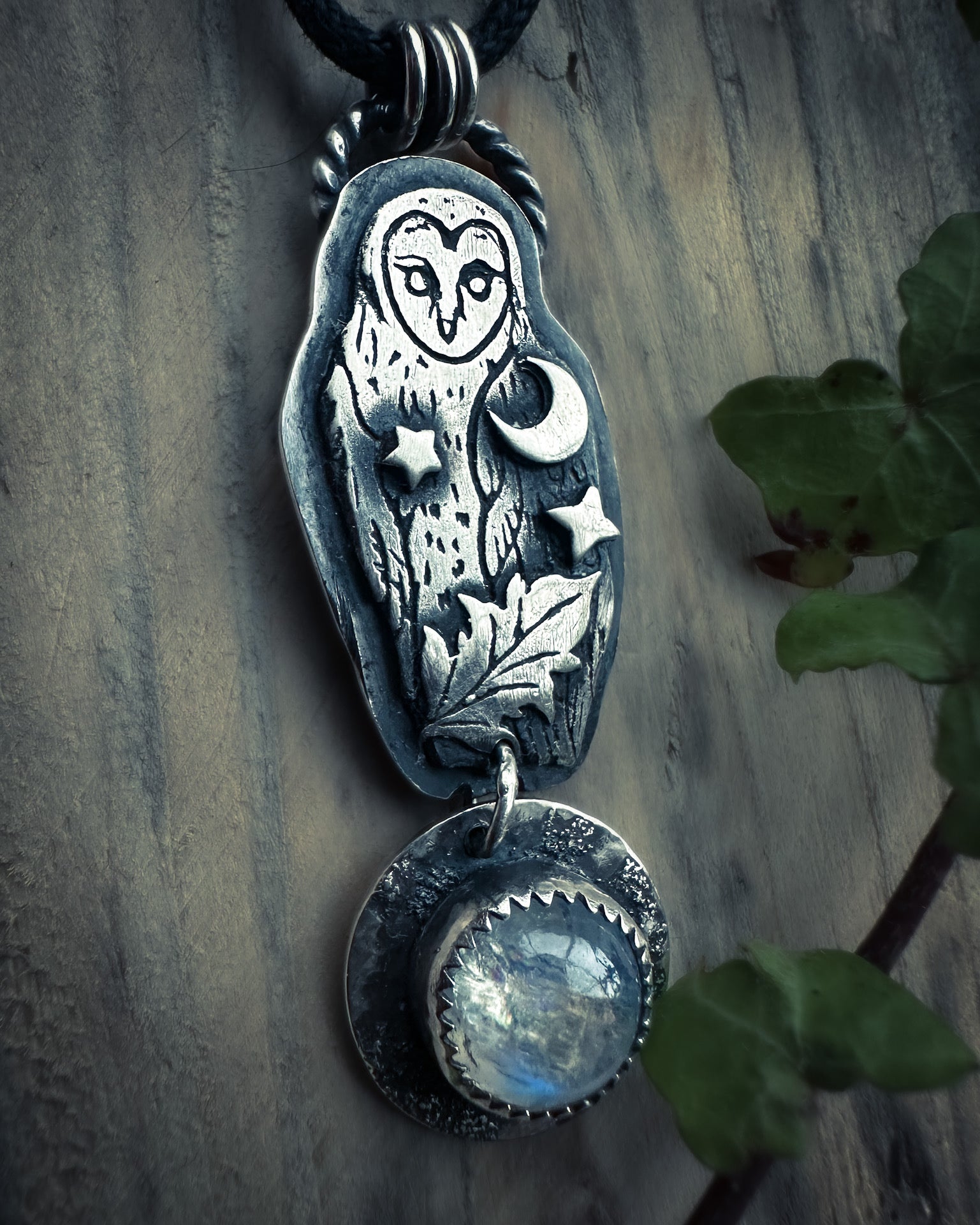 Intricate barn owl jewelry featuring a star, leaf, and vivid blue moonstone.