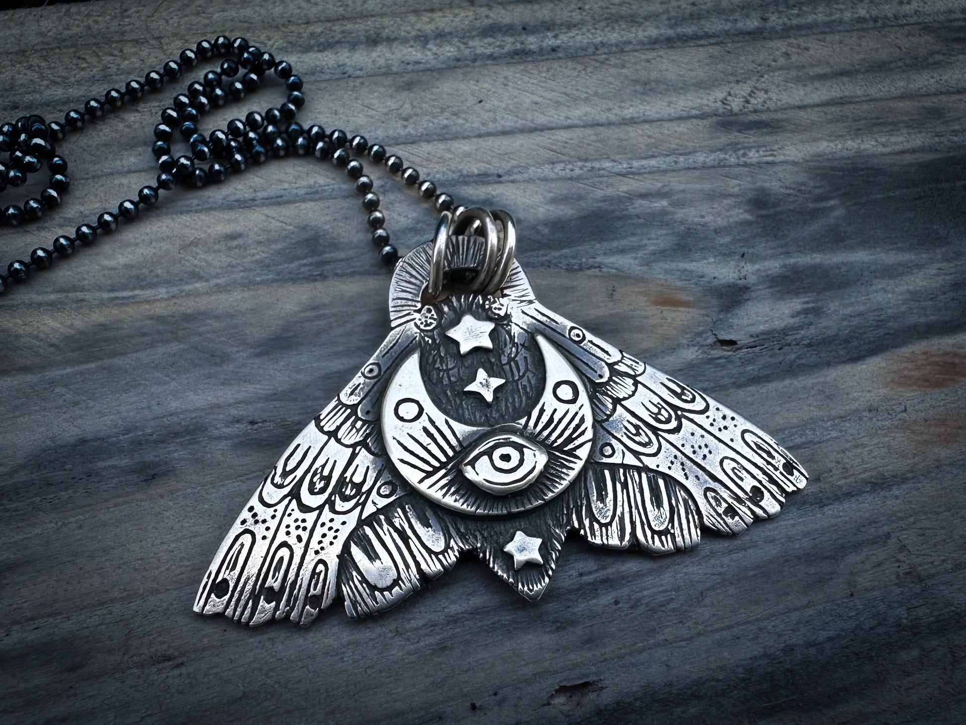 Handmade sterling silver Moth pendant with an All-Seeing Eye and sickle moon design