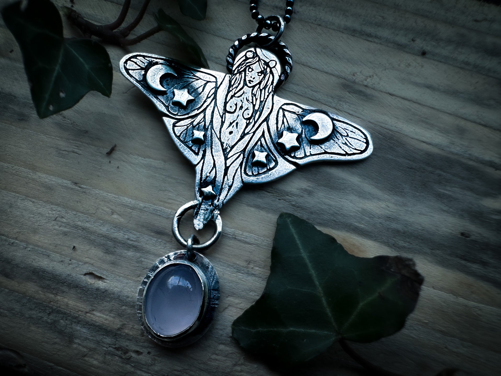 Sterling silver moth-wing faerie pendant with a pale lilac chalcedony accent