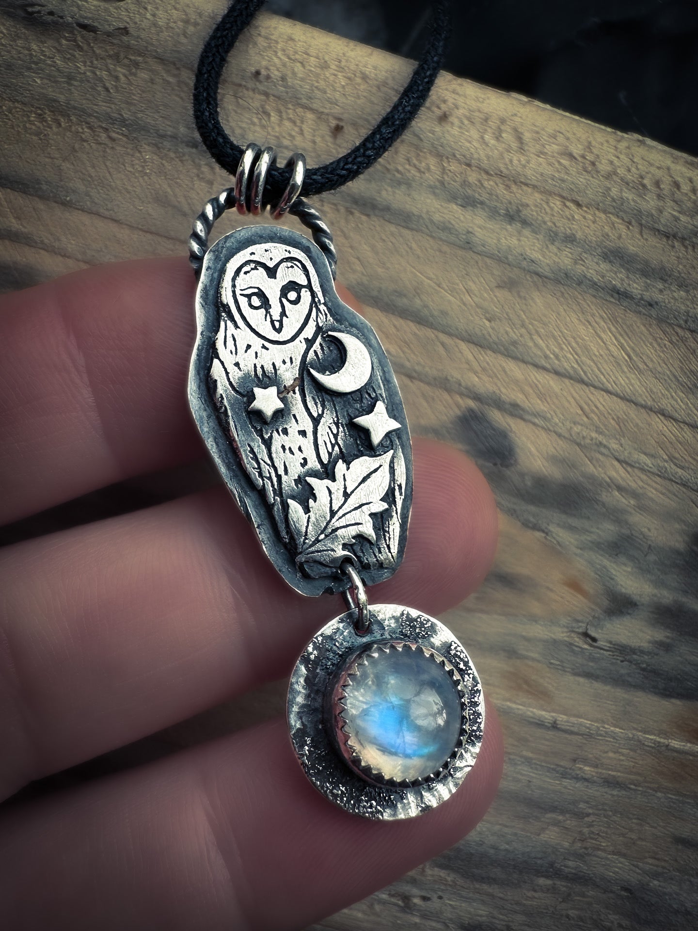 Sterling silver owl necklace with crescent moon, star, and glowing moonstone.