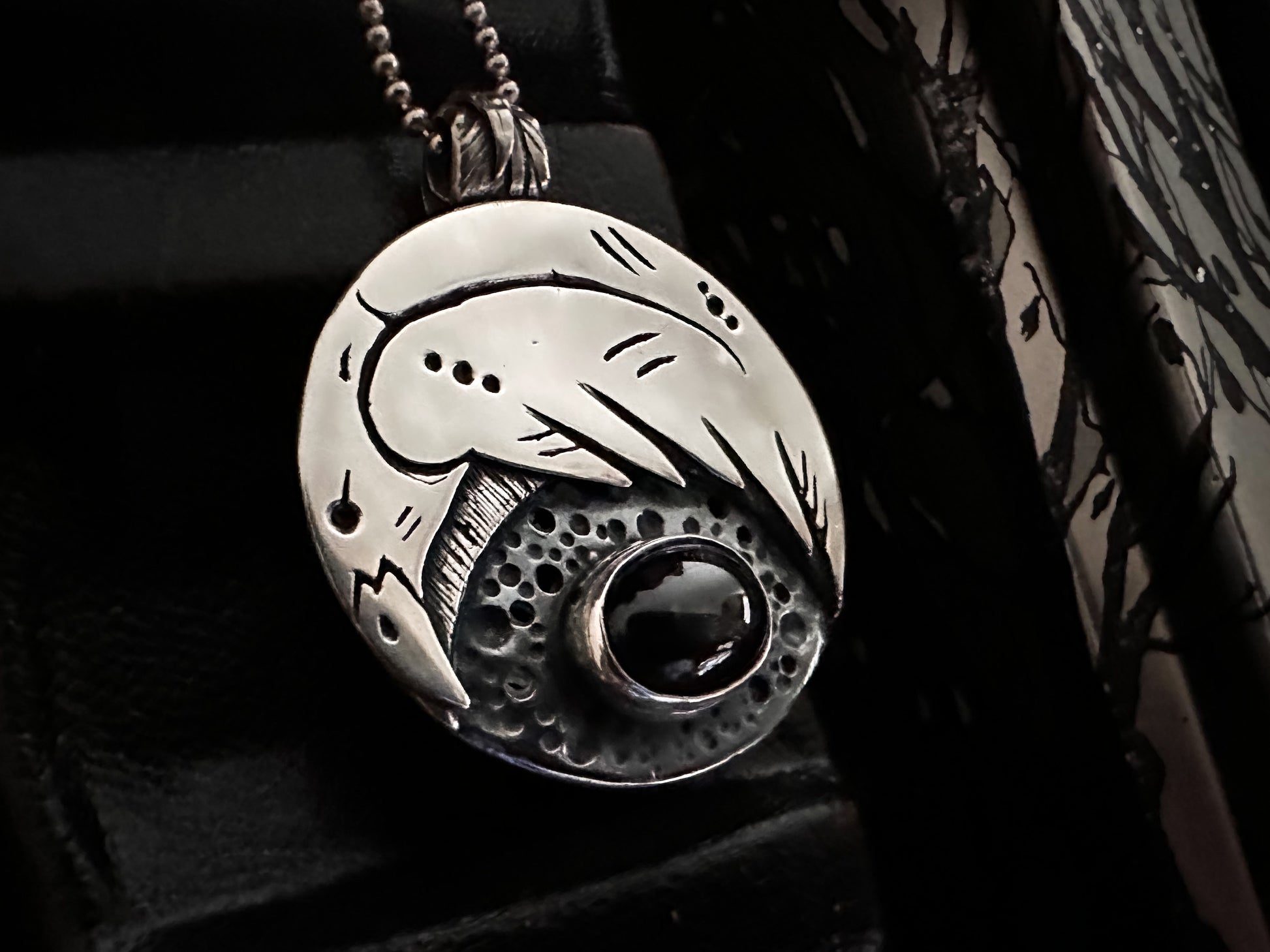 Silver raven or crow pendant with black star diopside, polished for a high-shine finish. Viking style design by Silver Labyrinth Jewelry 