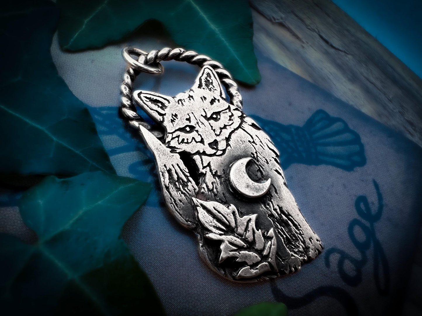 A little woodland fox with crescent moon and leaf. Handmade in sterling silver. Fine details, patina, polished. From The Little Familiars Collection, Jen Smith, Silver Labyrinth Jewelry