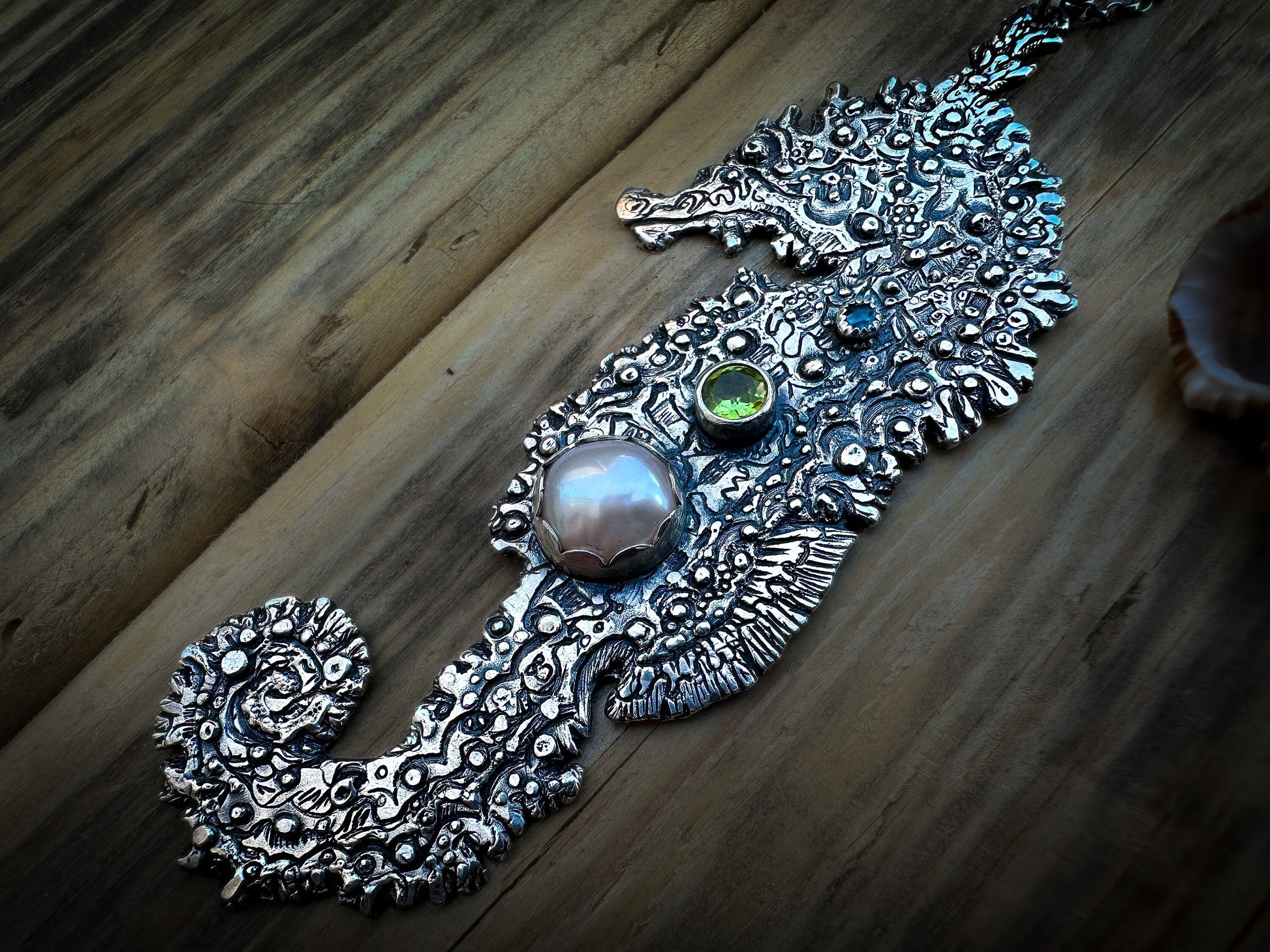 Silver seahorse pendant with vibrant peridot, neon apatite and a freshwater pearl, handmade with organic texture. Handmade by Jen Smith, Silver Labyrinth Jewelry