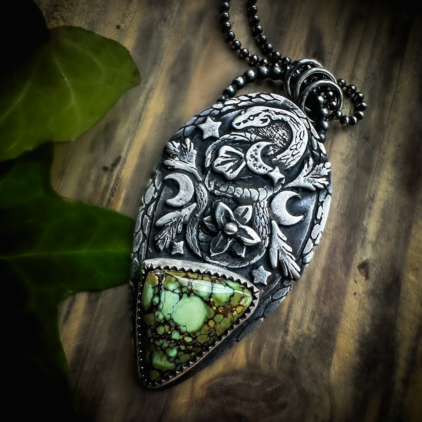 Little Familiars snake pendant with exquisite leaf and flower details and a heart-soothing Damele variscite cabochon