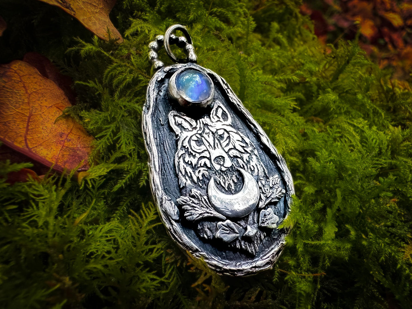 Wild Wolf Pendant with Rainbow Moonstone in Sterling Silver. Designed and handmade by Jen Smith silverlabyrinthjewelry.com