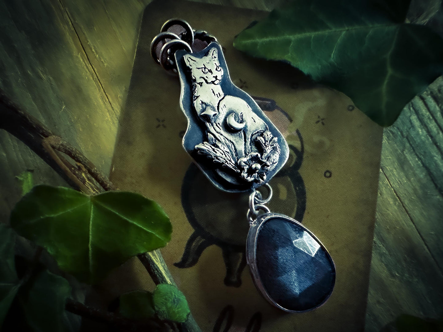 Mistress Cat, gothic pendant with black moonstone, star, crescent moon and leaf details. Handmade in sterling silver. From Jen Smith’s Little Familiars Collection @silverlabyrinthjewelry