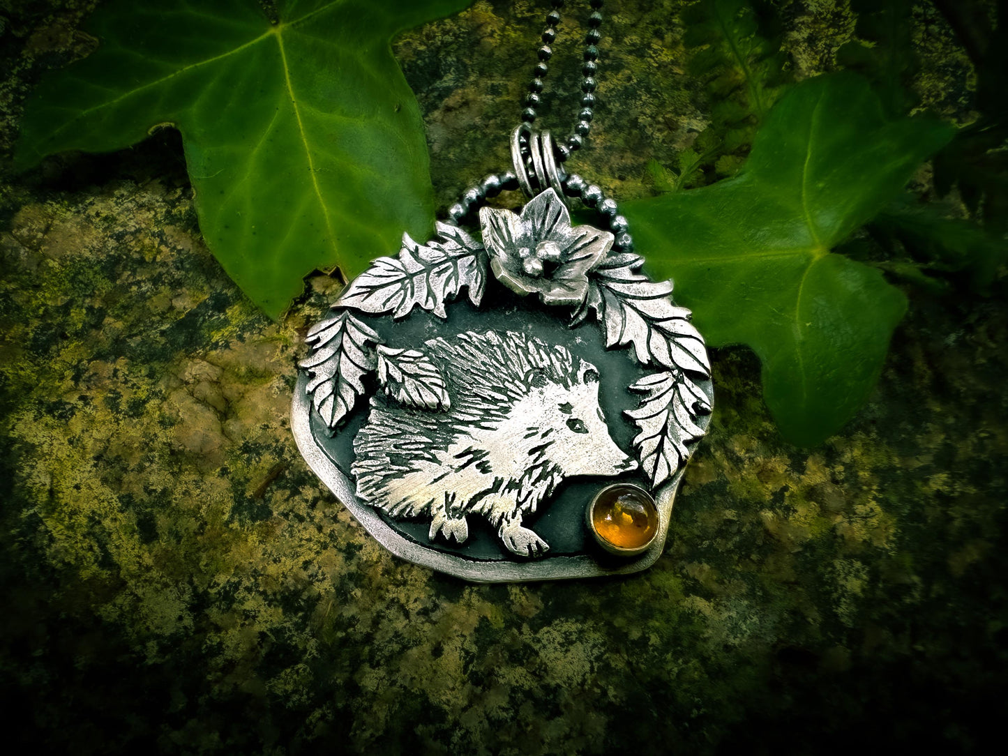 view from base, detailed sterling silver Hedgehog lovers pendant, handmade in the UK by Silver Labyrinth Jewelry. 